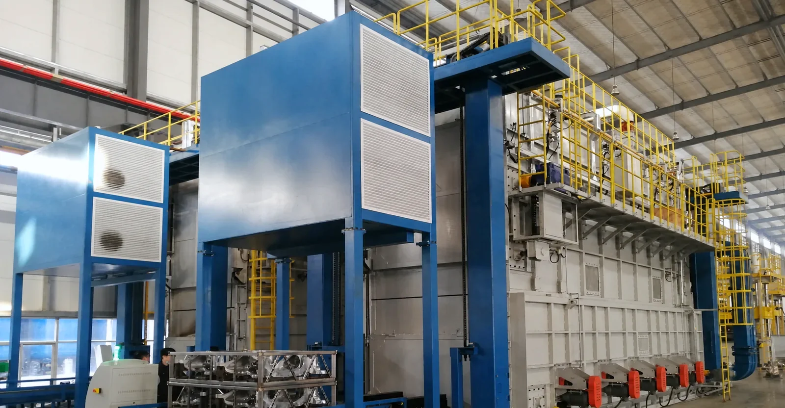Industrial heat-treatment line with guarded access platforms