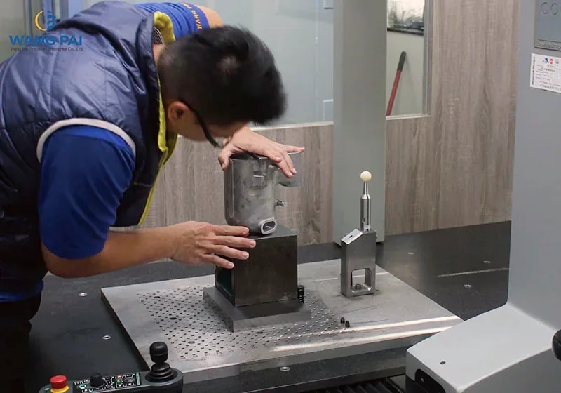 Operator positioning a component at a coordinate measuring machine