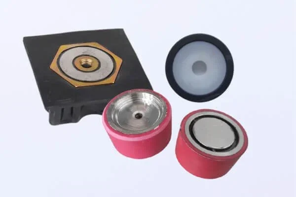 Holding magnet assembly configurations