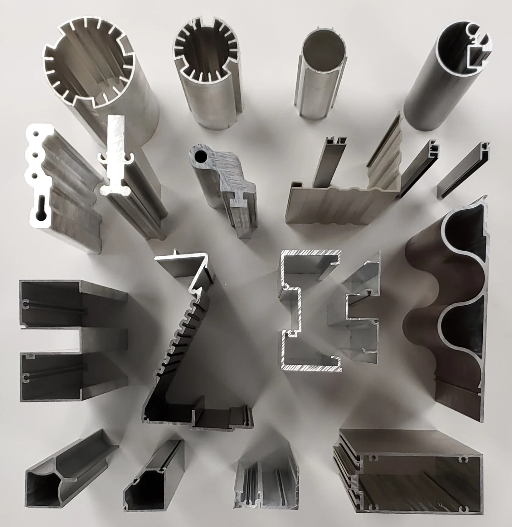 Machined aluminium extrusion with drilled features