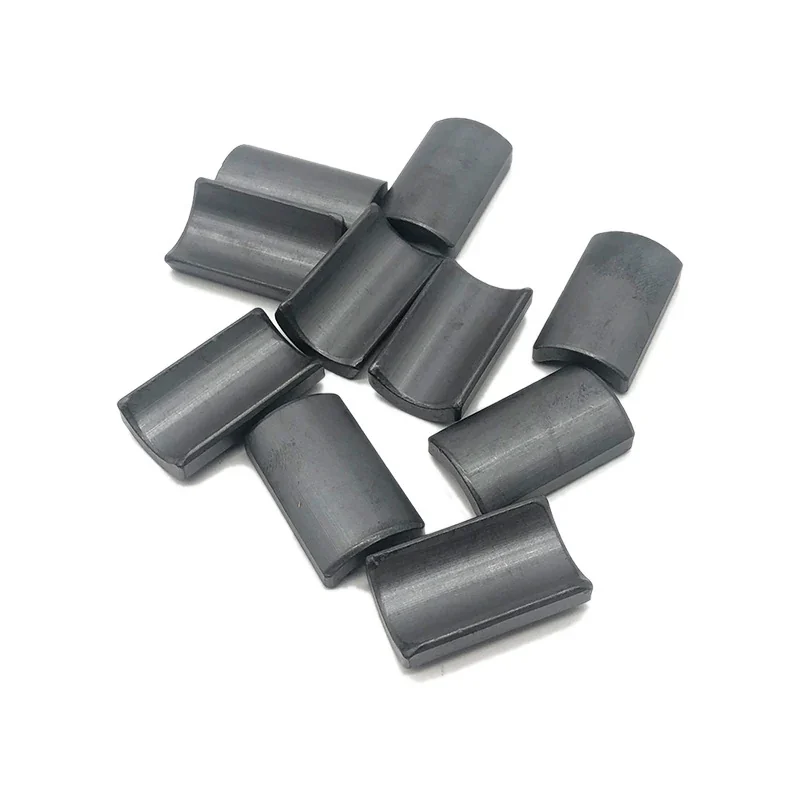 Ferrite motor arc magnets in volume