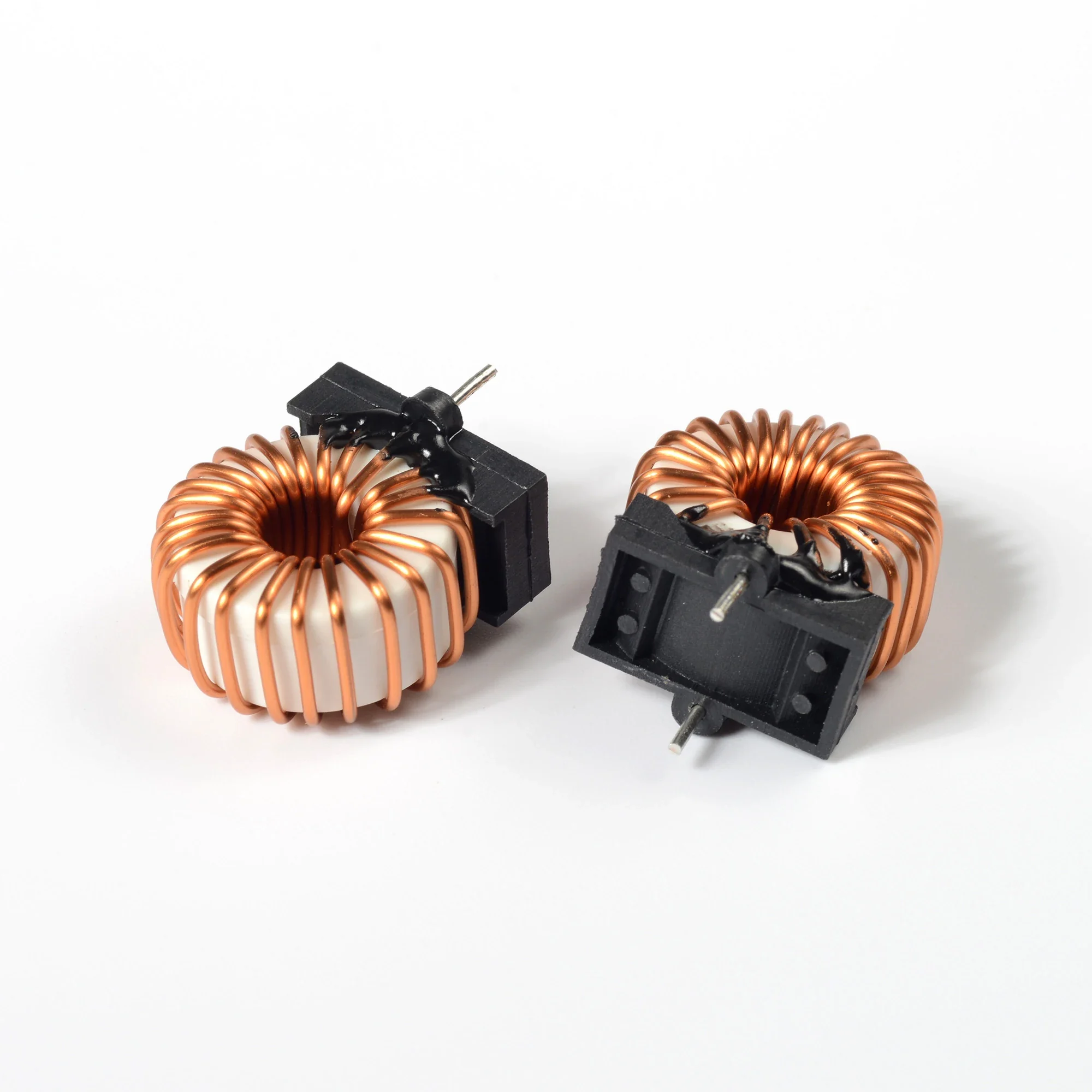 Wound choke assembly on soft magnetic core