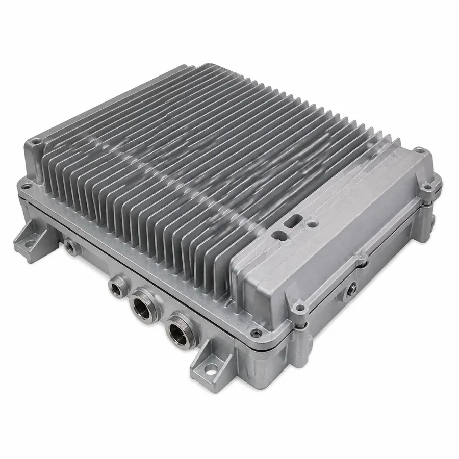 Finned die-cast aluminum 5G radio unit housing on white background
